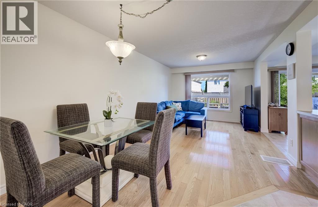 Open-concept living area with wood-finish flooring - 496 Langlaw Drive, Cambridge, ON - Indoor Photo Showing Dining Room