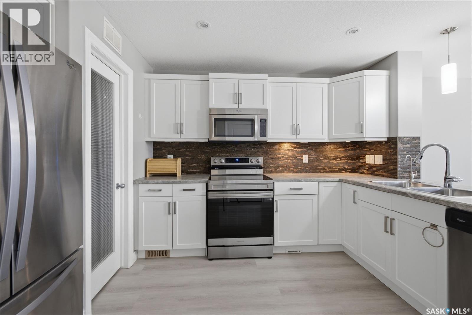 4845 Liberty Street, Regina, SK - Indoor Photo Showing Kitchen With Double Sink