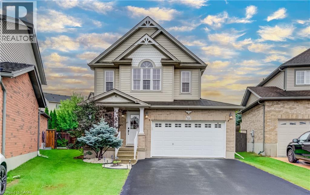 Two-story residence featuring light-colored siding and brick accents - 521 Snowdrop Court, Kitchener, ON - Outdoor With Facade