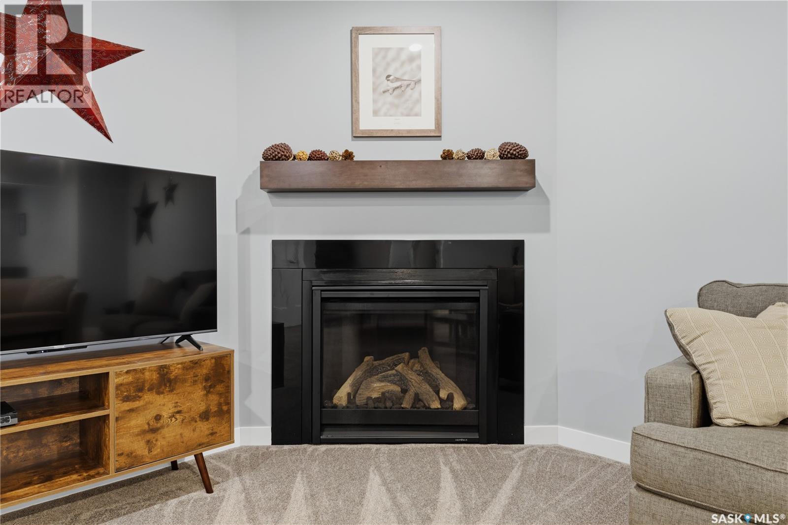 12 Valley Ridge Road, Last Mountain Lake, SK - Indoor Photo Showing Living Room With Fireplace
