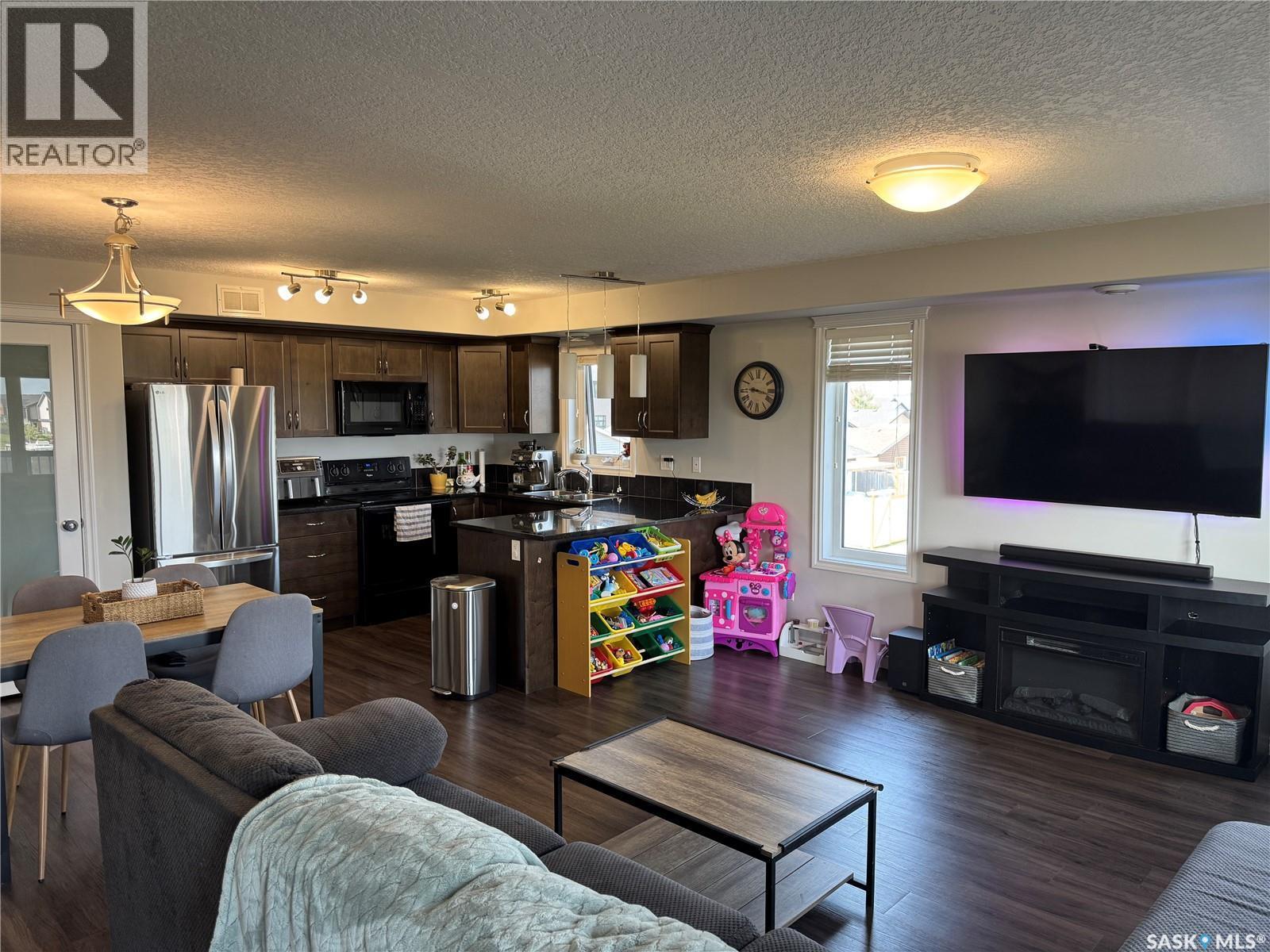 108 210 Rajput Way, Saskatoon, SK - Indoor Photo Showing Living Room