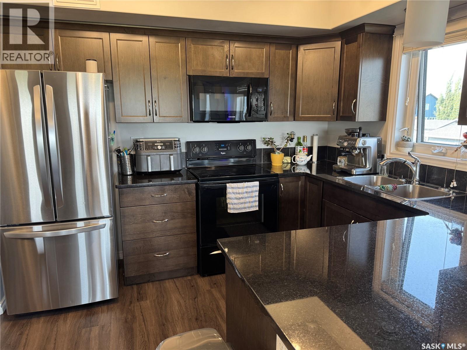 108 210 Rajput Way, Saskatoon, SK - Indoor Photo Showing Kitchen With Double Sink