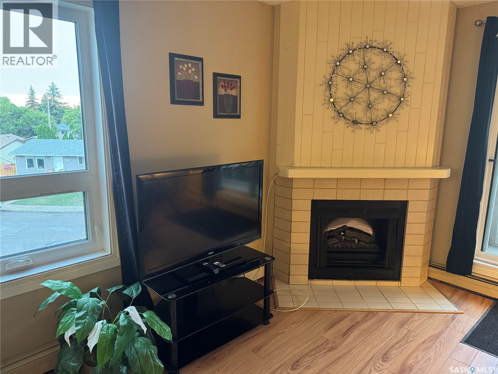 237 510 Prairie Avenue, Saskatoon, SK - Indoor Photo Showing Living Room With Fireplace