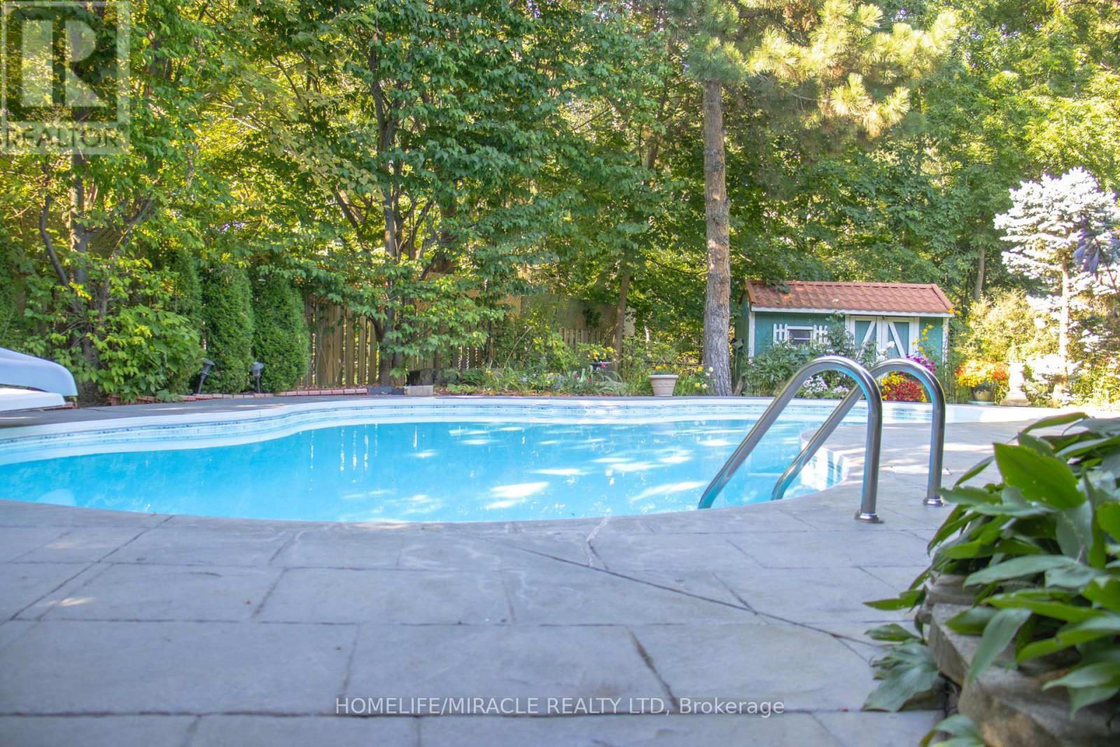 2023 Jacamar Court, Mississauga, ON - Outdoor With In Ground Pool