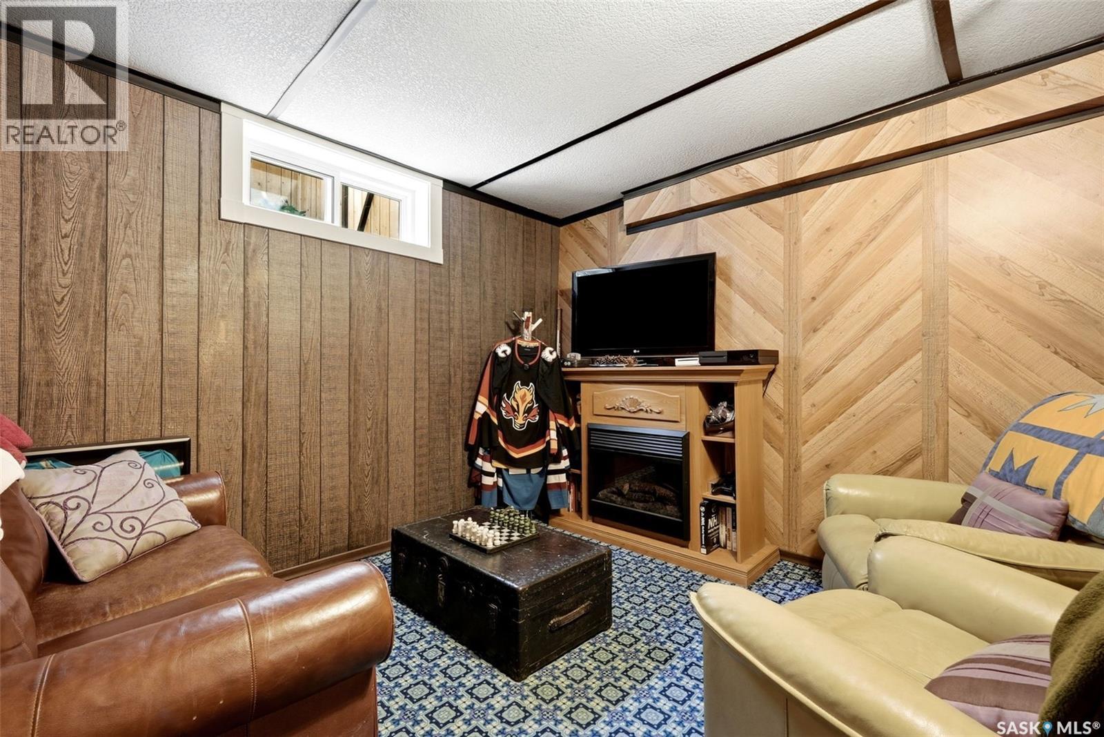 7208 Dewdney Avenue, Regina, SK - Indoor Photo Showing Living Room With Fireplace