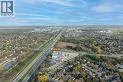 Aerial perspective showcasing a developed suburban area with extensive tree coverage - 