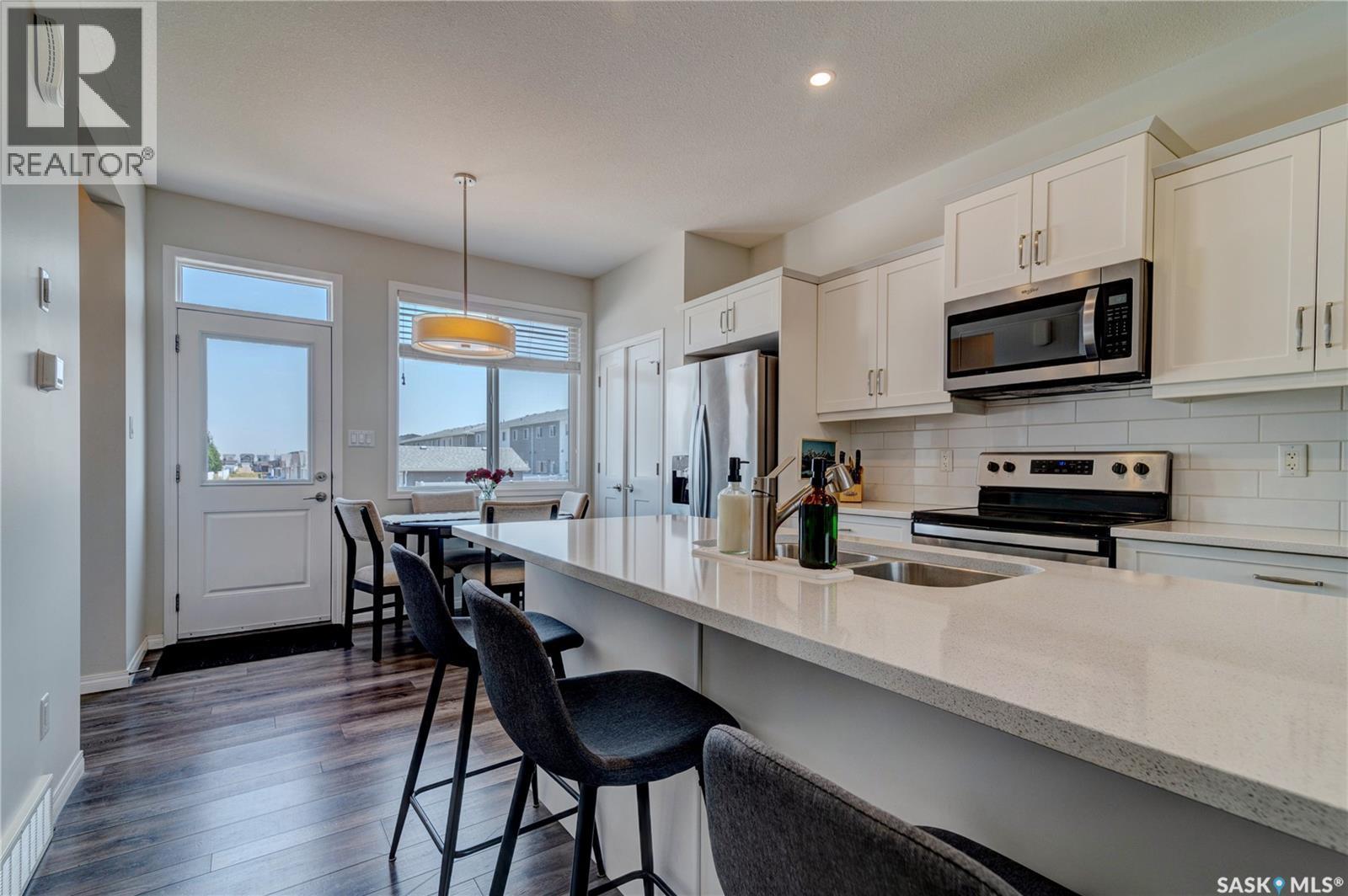 3277 Chuka Boulevard, Regina, SK - Indoor Photo Showing Kitchen With Stainless Steel Kitchen With Double Sink With Upgraded Kitchen
