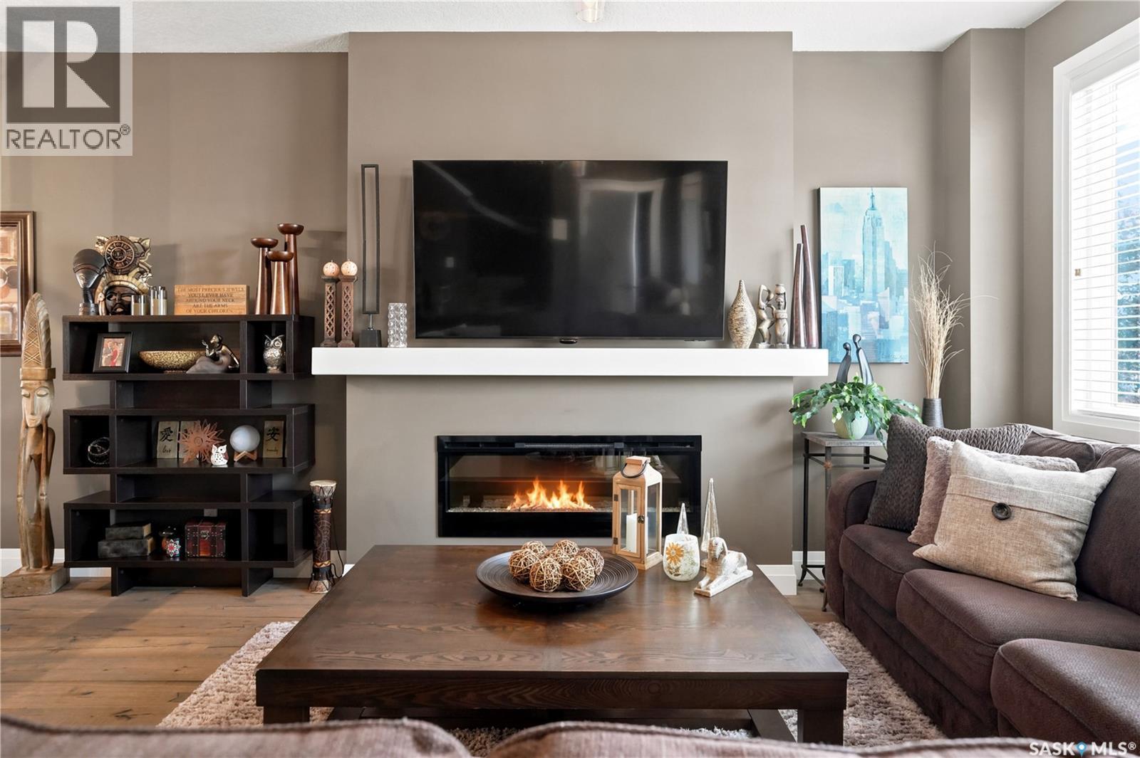 5413 Green Silverberry Drive E, Regina, SK - Indoor Photo Showing Living Room With Fireplace