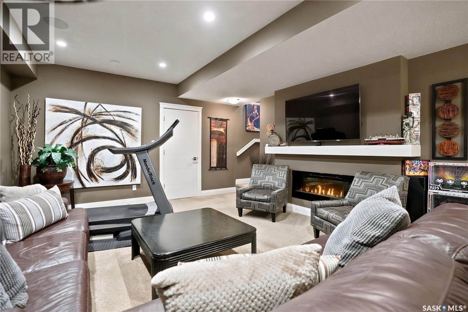 5413 Green Silverberry Drive E, Regina, SK - Indoor Photo Showing Living Room With Fireplace