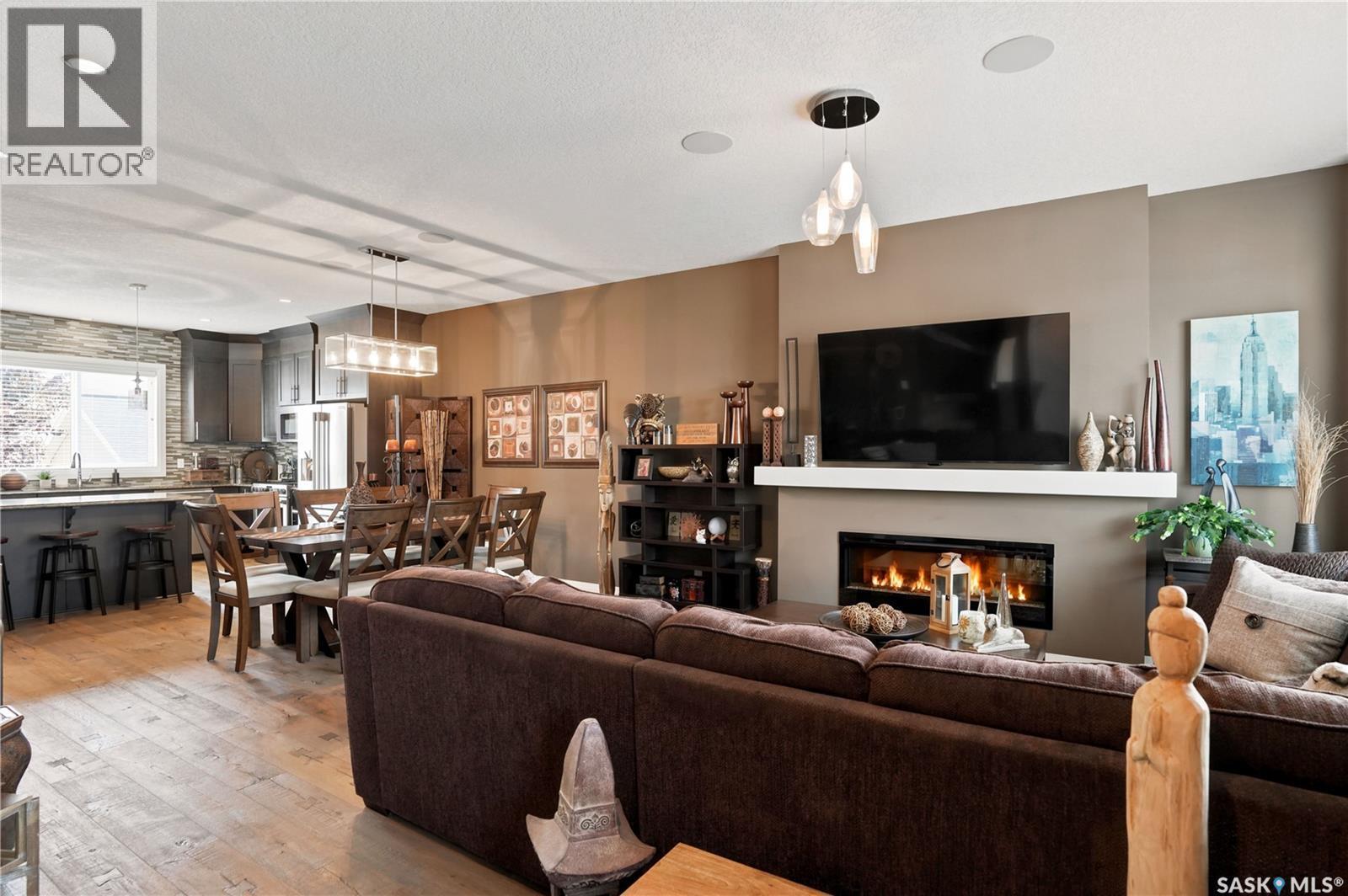 5413 Green Silverberry Drive E, Regina, SK - Indoor Photo Showing Living Room With Fireplace