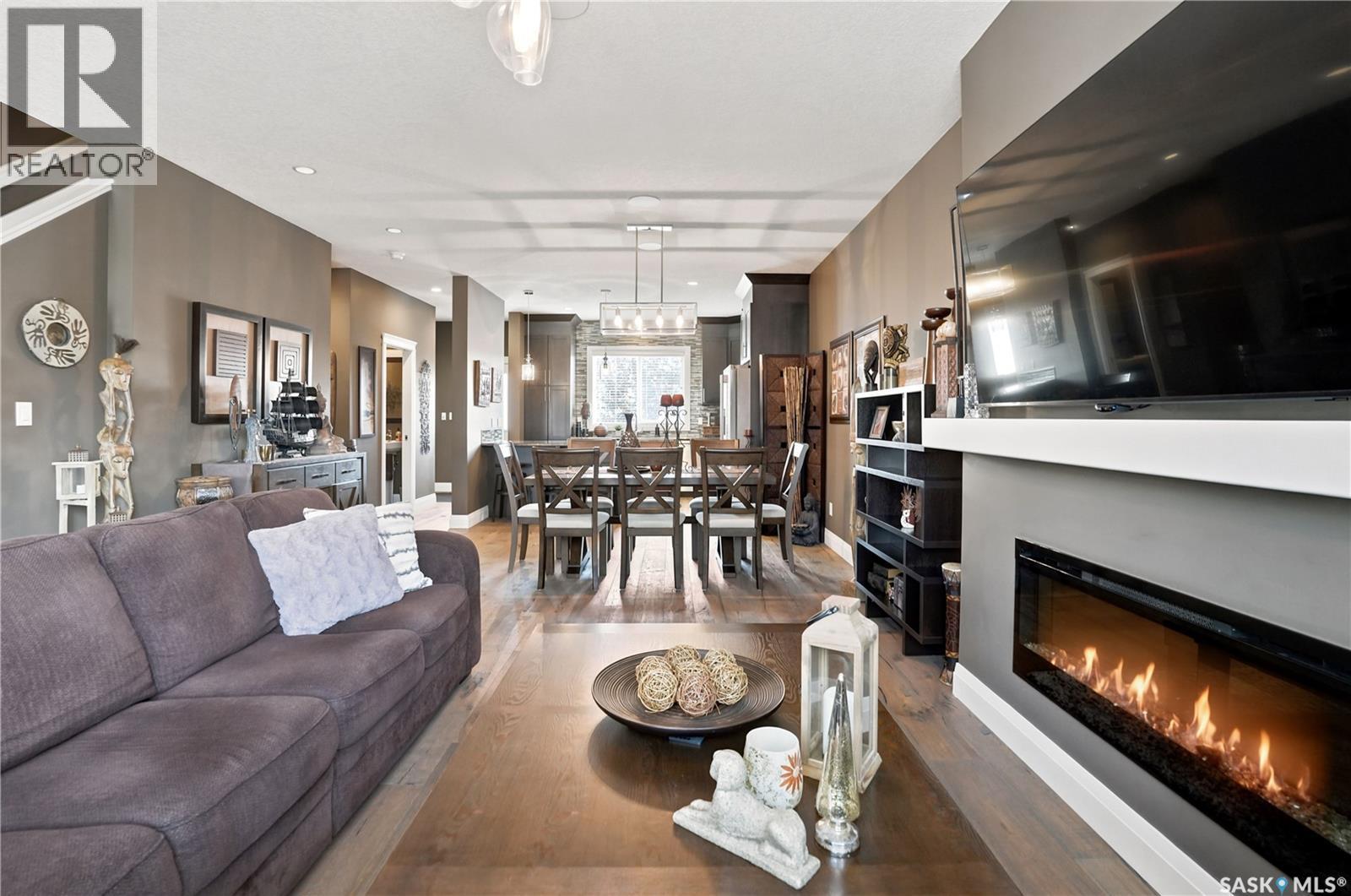 5413 Green Silverberry Drive E, Regina, SK - Indoor Photo Showing Living Room With Fireplace