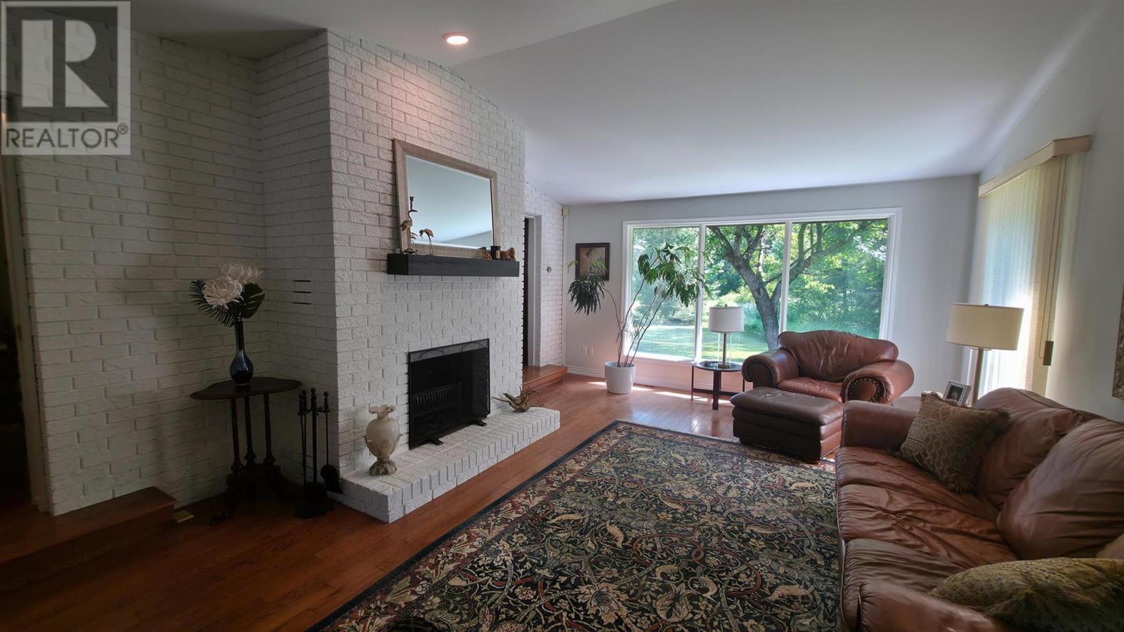 823 Fourth Lin E, Sault Ste. Marie, ON - Indoor Photo Showing Living Room With Fireplace