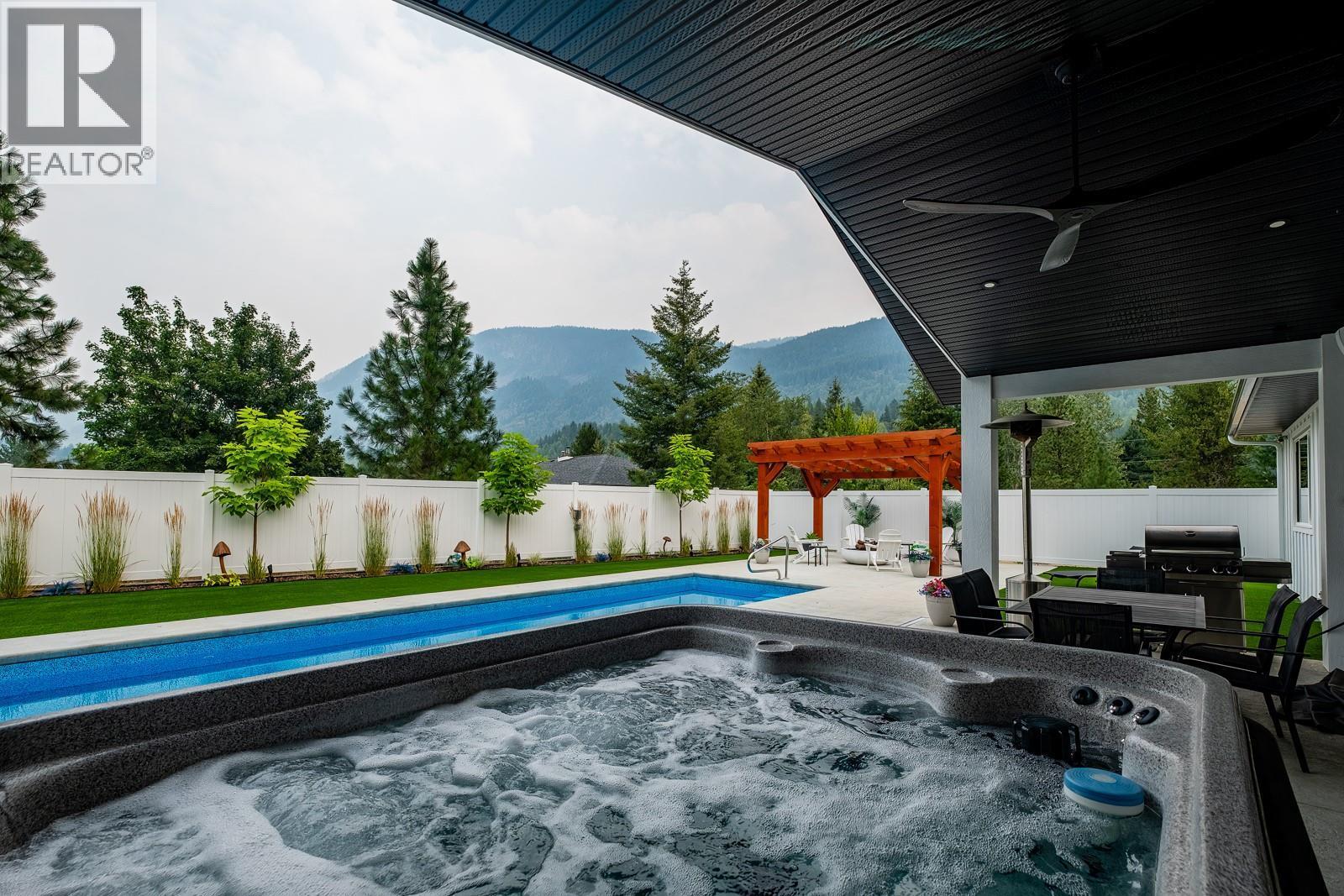 1217 Mcphee Road, Castlegar, BC - Outdoor With In Ground Pool With Deck Patio Veranda With Backyard