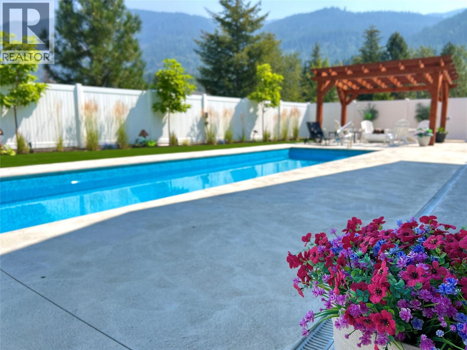 1217 Mcphee Road, Castlegar, BC - Outdoor With In Ground Pool With Backyard