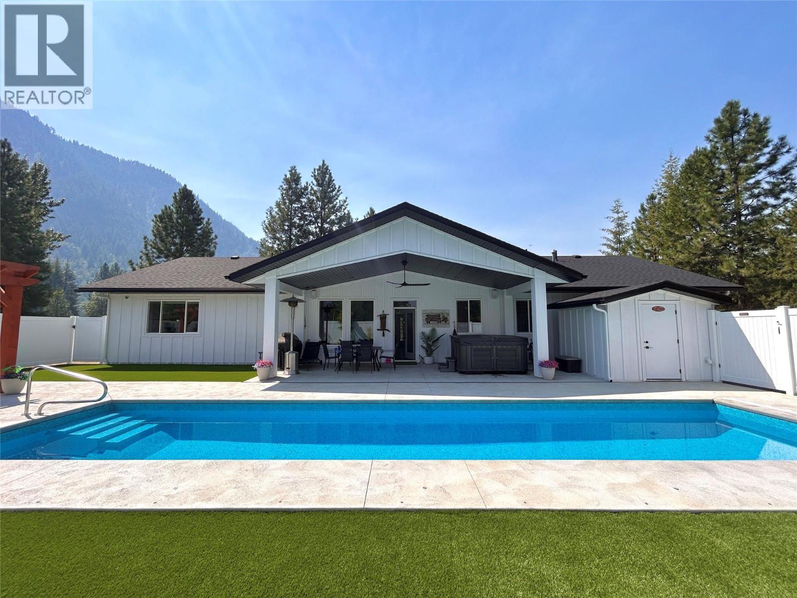 1217 Mcphee Road, Castlegar, BC - Outdoor With In Ground Pool With Deck Patio Veranda With Backyard