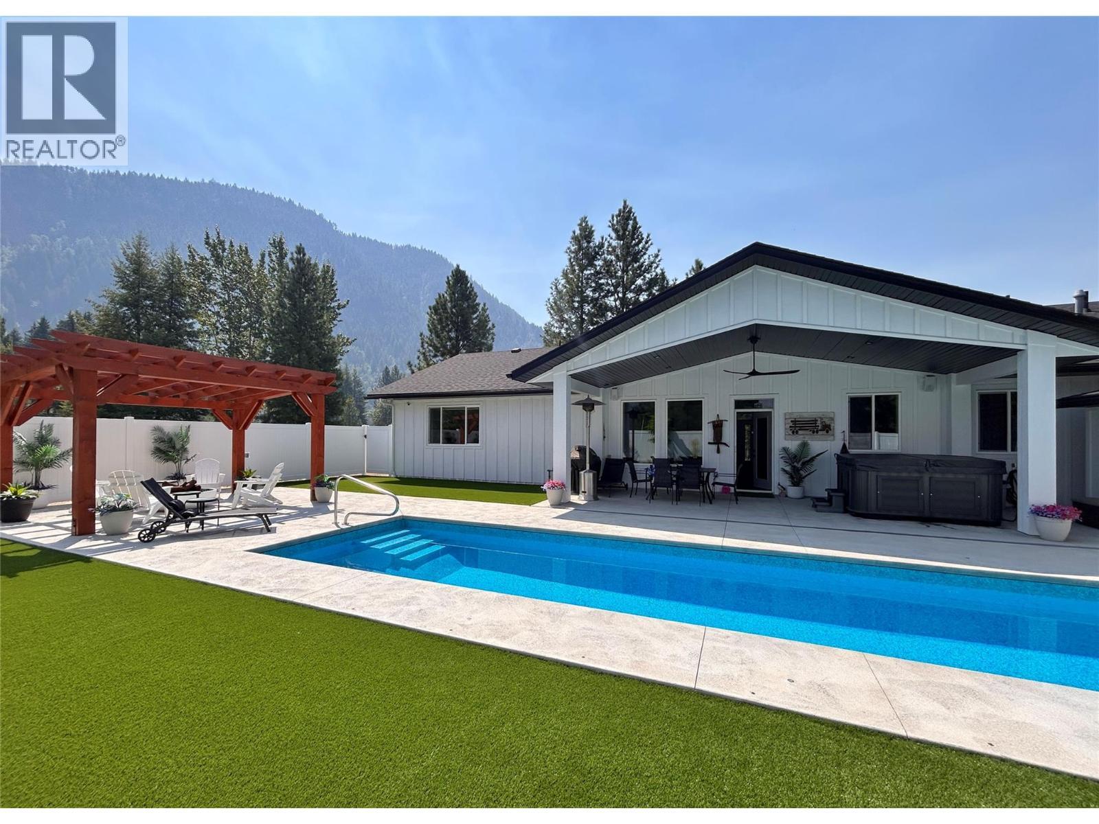 1217 Mcphee Road, Castlegar, BC - Outdoor With In Ground Pool With Deck Patio Veranda