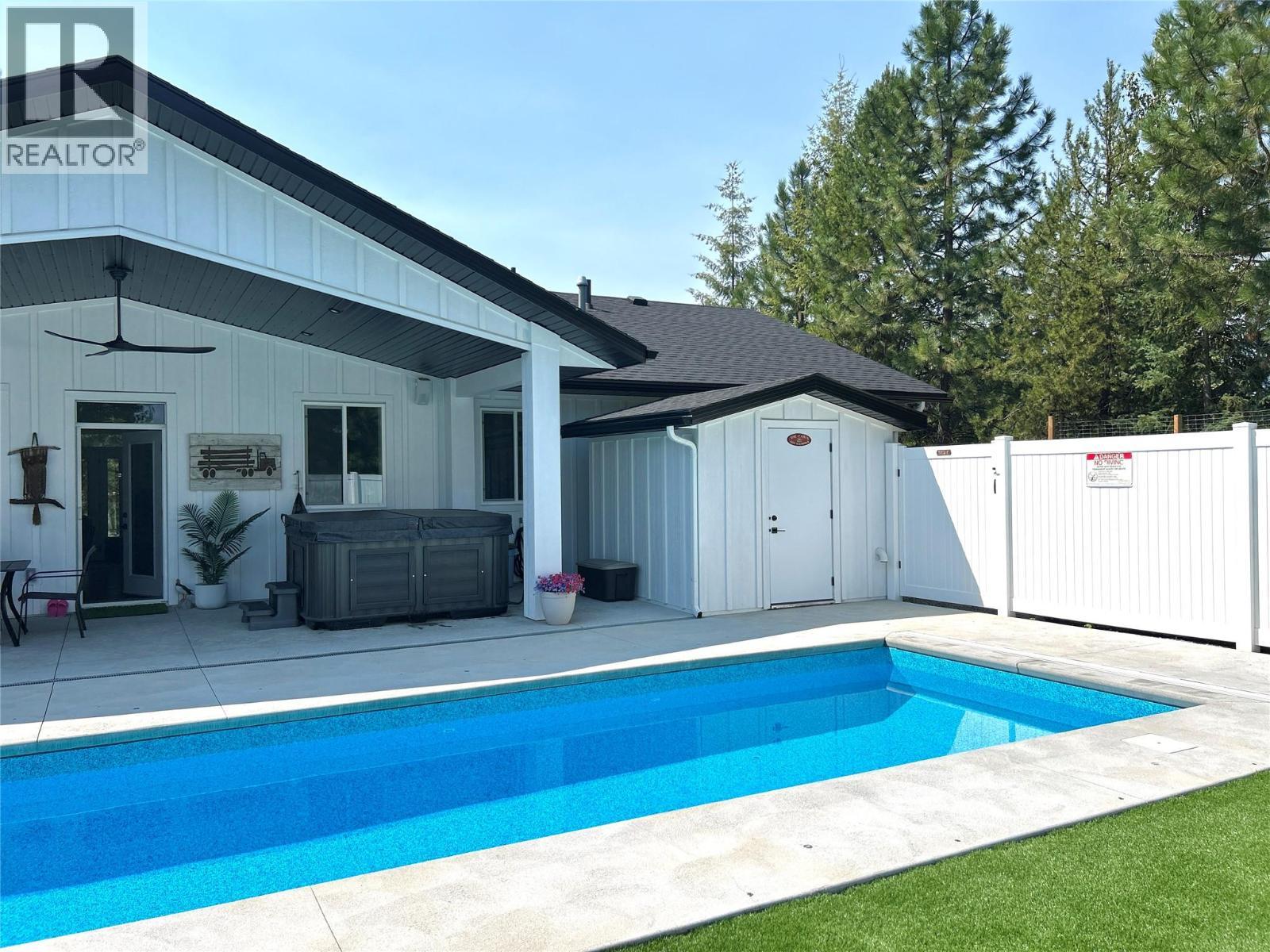 1217 Mcphee Road, Castlegar, BC - Outdoor With In Ground Pool With Deck Patio Veranda
