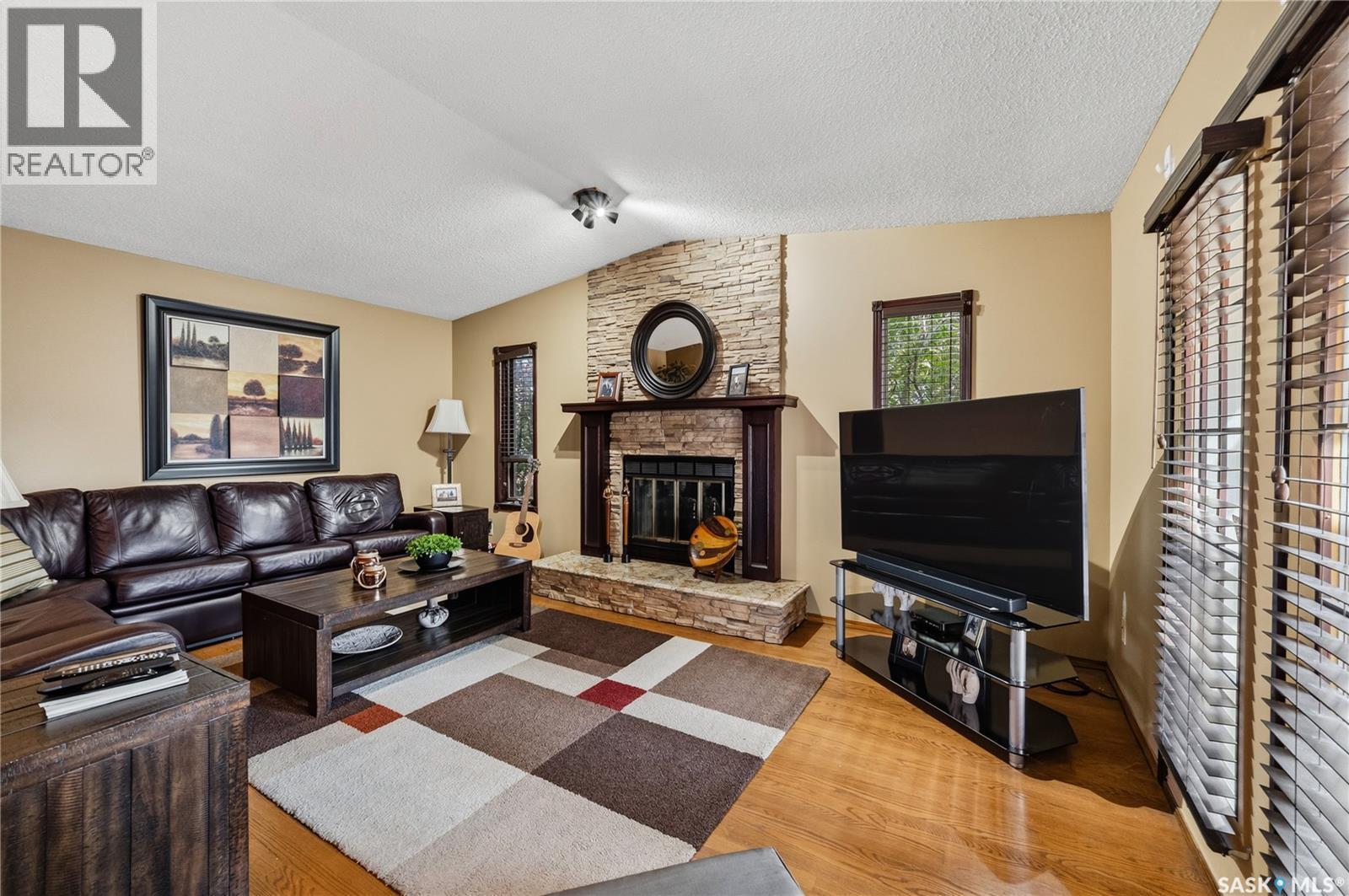 3603 Selinger Crescent, Regina, SK - Indoor Photo Showing Living Room With Fireplace
