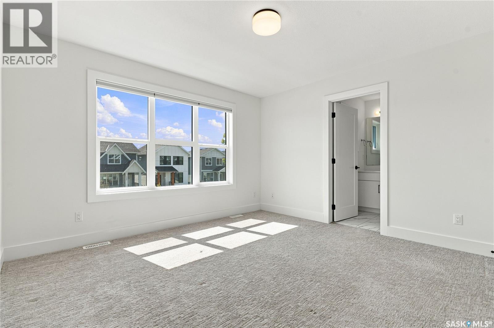 115 Rosewood Boulevard E, Saskatoon, SK - Indoor Photo Showing Other Room