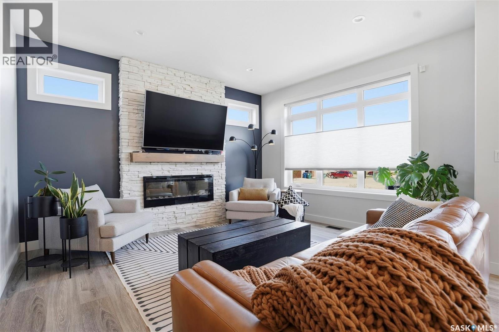 250 Skopik Crescent, Saskatoon, SK - Indoor Photo Showing Living Room With Fireplace