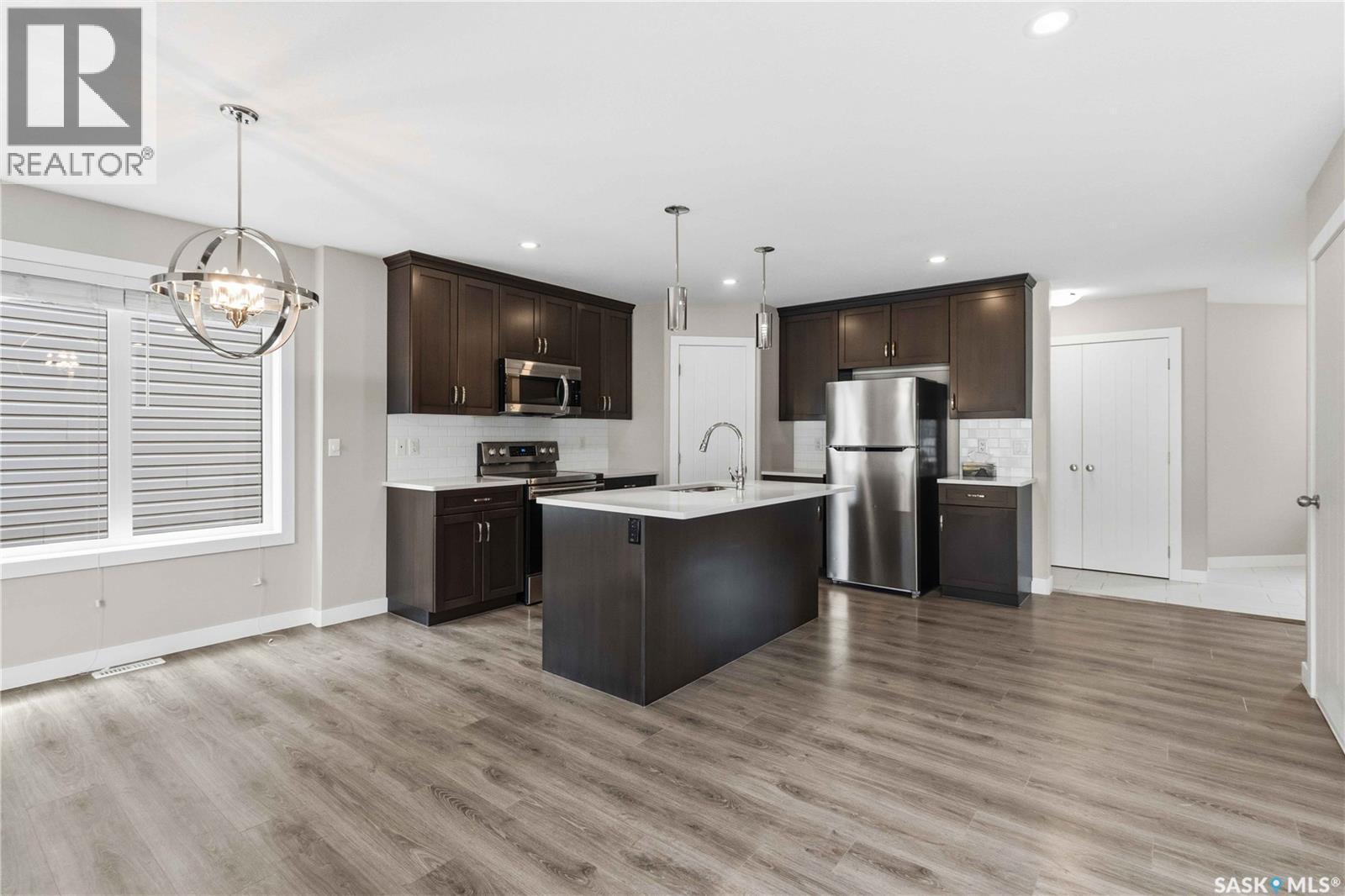 139 Dagnone Lane, Saskatoon, SK - Indoor Photo Showing Kitchen With Upgraded Kitchen