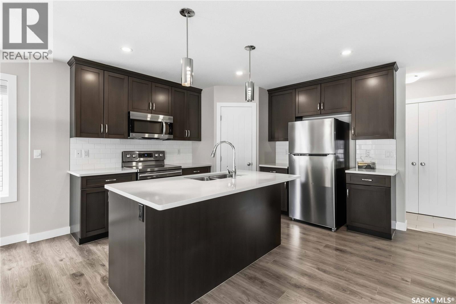 139 Dagnone Lane, Saskatoon, SK - Indoor Photo Showing Kitchen With Double Sink With Upgraded Kitchen