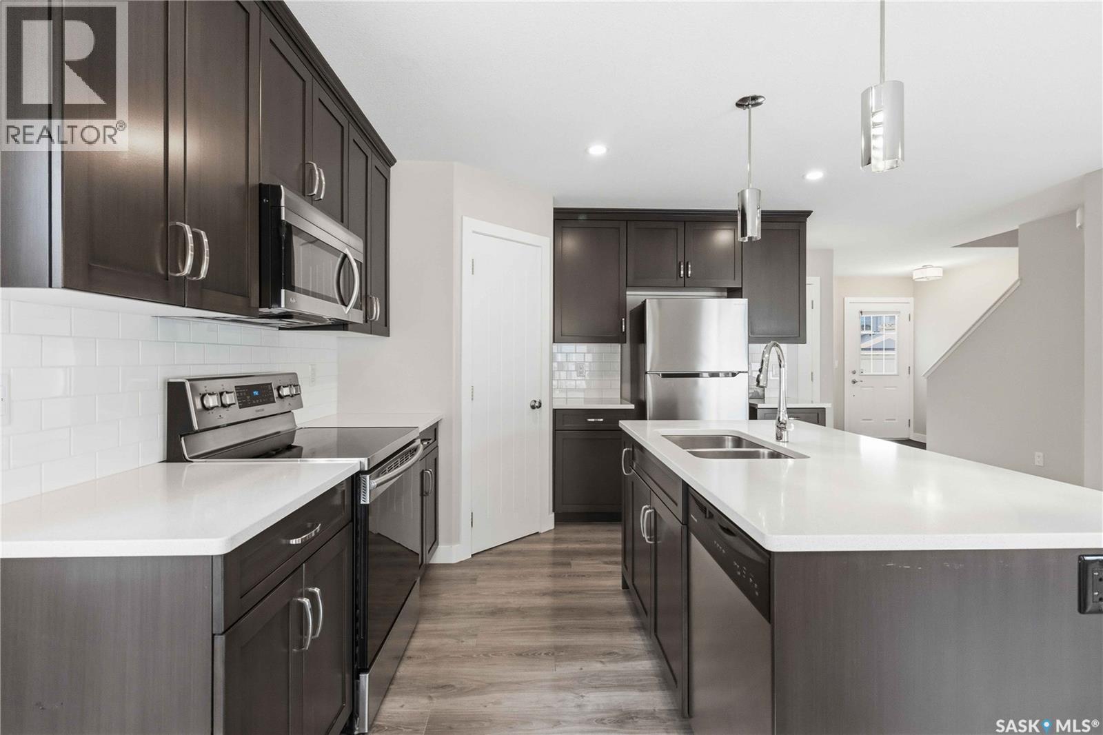 139 Dagnone Lane, Saskatoon, SK - Indoor Photo Showing Kitchen With Double Sink With Upgraded Kitchen