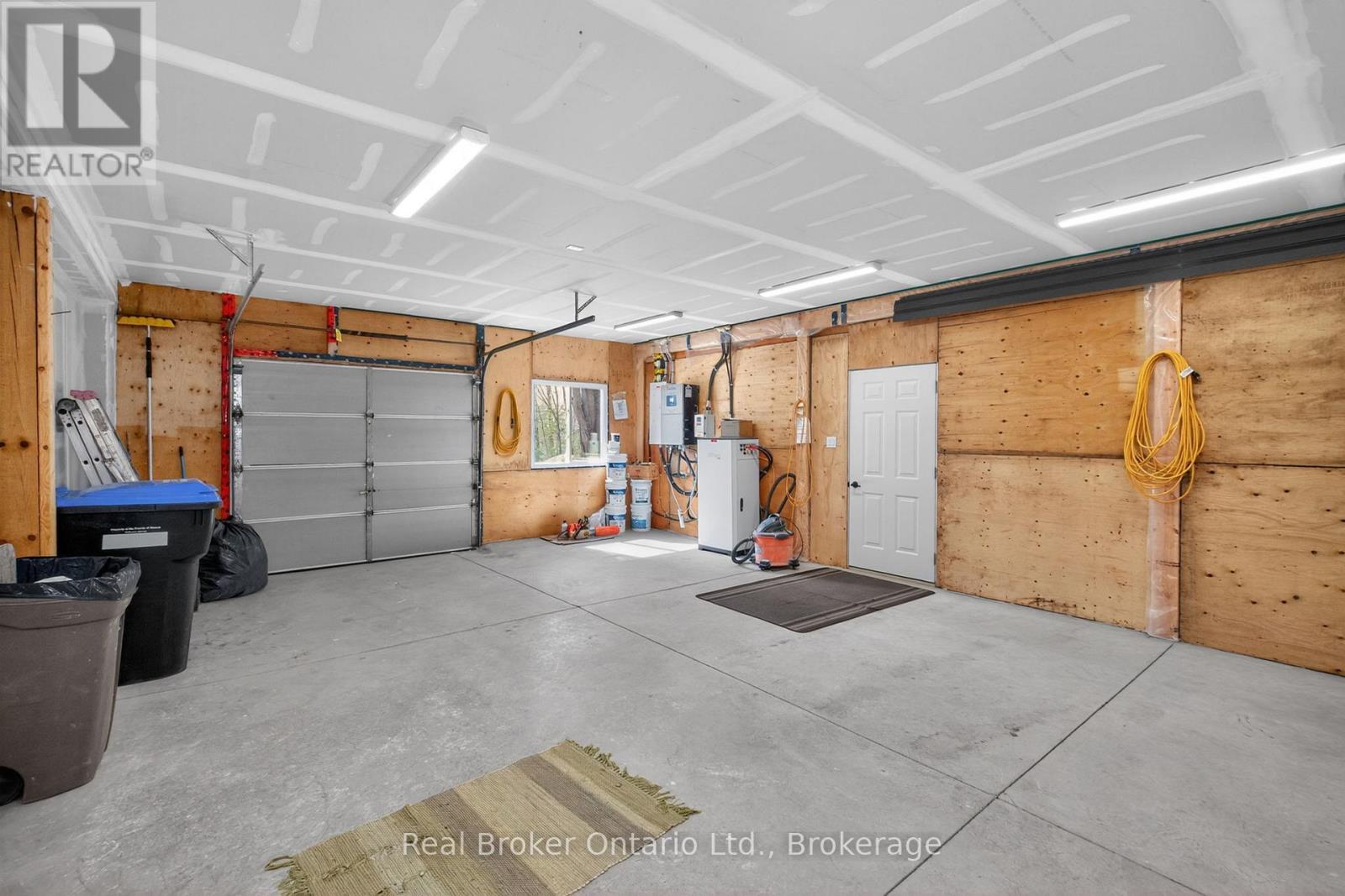 90 14 Concession E, Tiny, ON - Indoor Photo Showing Garage