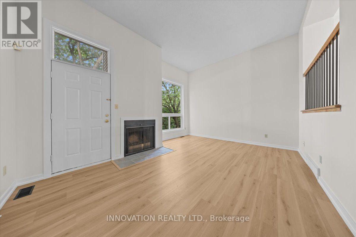 2 - 76 Esterlawn Private, Ottawa, ON - Indoor Photo Showing Other Room With Fireplace