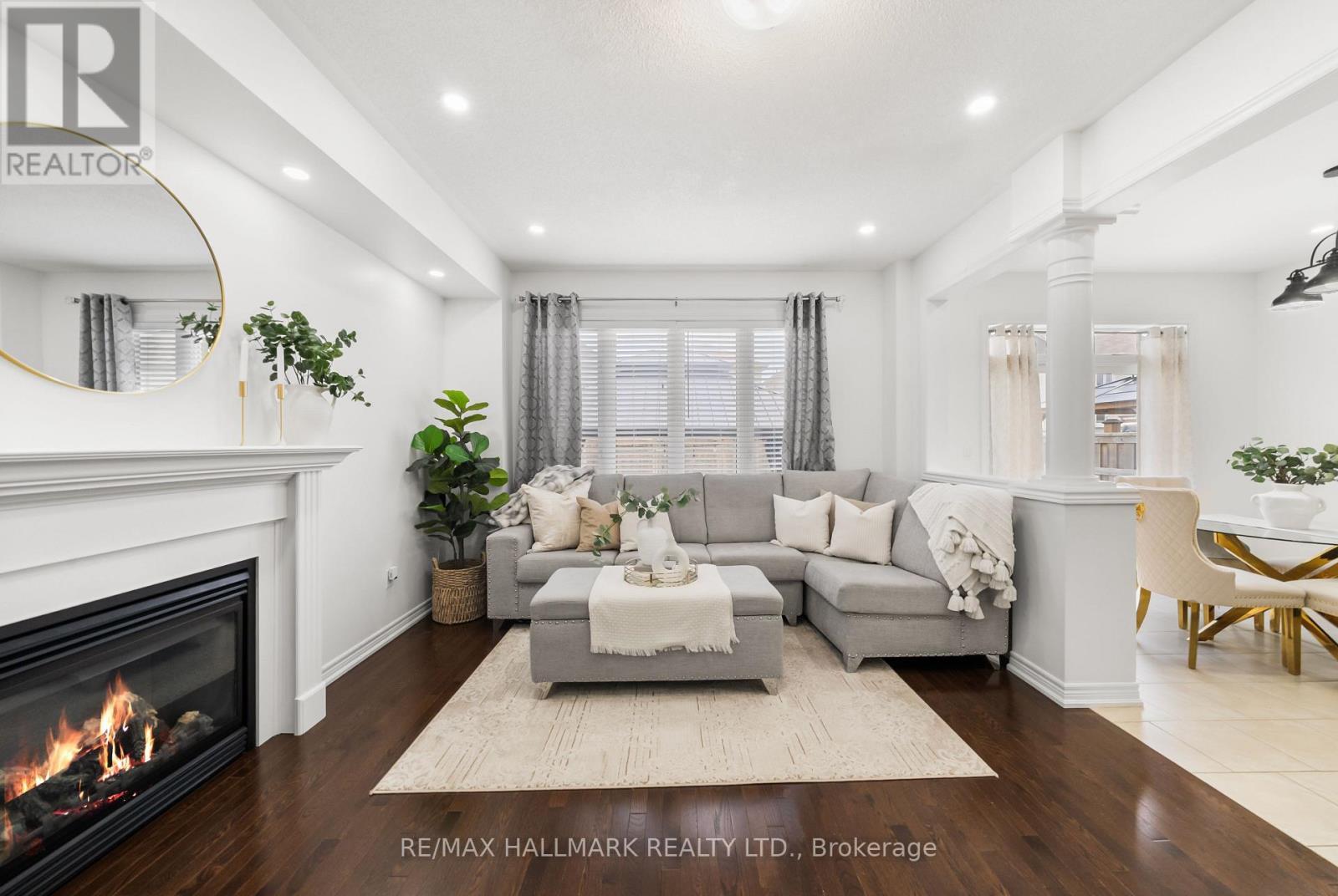 upgraded trim, gas fireplace and potlights. - 152 Mcdonald Crescent, Clarington, ON - Indoor Photo Showing Living Room With Fireplace