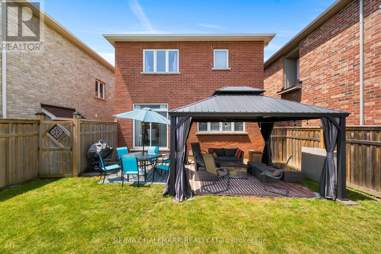 backyard with included gazebo and manicured lawns. - 152 Mcdonald Crescent, Clarington, ON - Outdoor With Deck Patio Veranda With Exterior