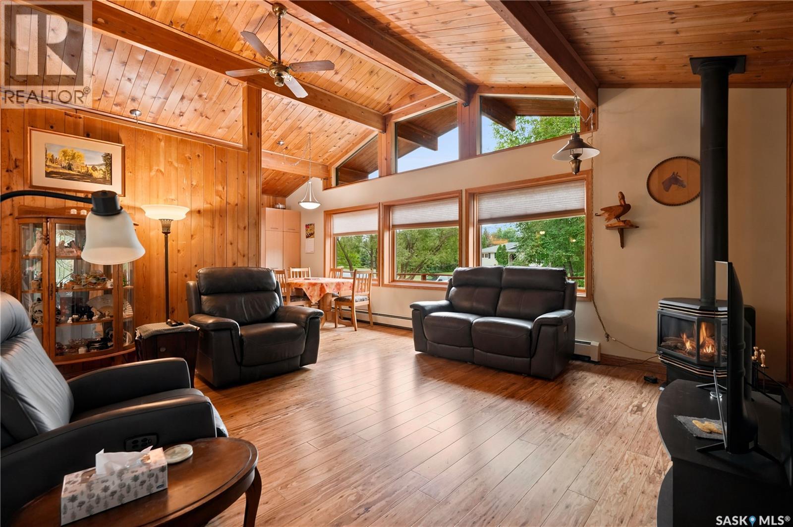 21 Meadow Road, White City, SK - Indoor Photo Showing Living Room With Fireplace