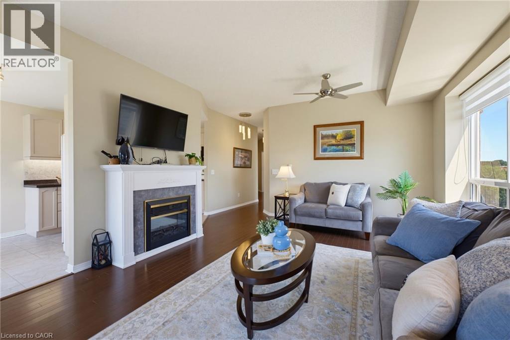 2000 Creekside Drive Unit# 605, Dundas, ON - Indoor Photo Showing Living Room With Fireplace