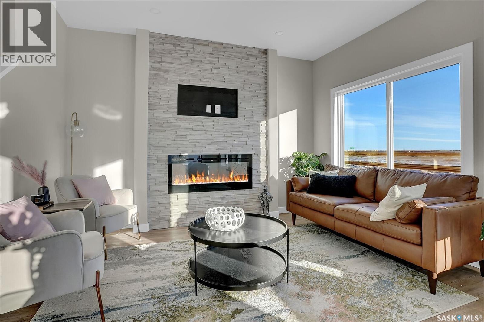 3005 Green Turtle Road, Regina, SK - Indoor Photo Showing Living Room With Fireplace