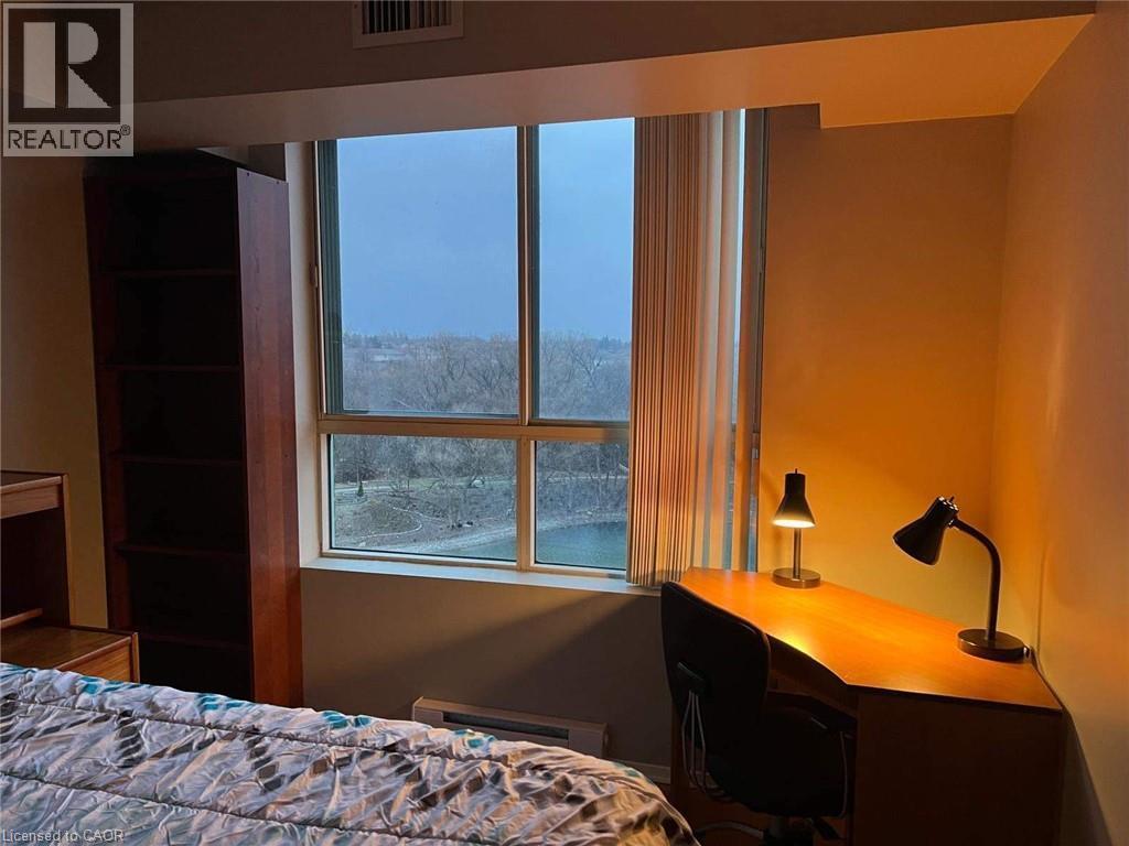 Corner window offering natural illumination and an expansive outdoor landscape - 30 Blue Springs Drive Unit# Ph3, Waterloo, ON - Indoor Photo Showing Bedroom