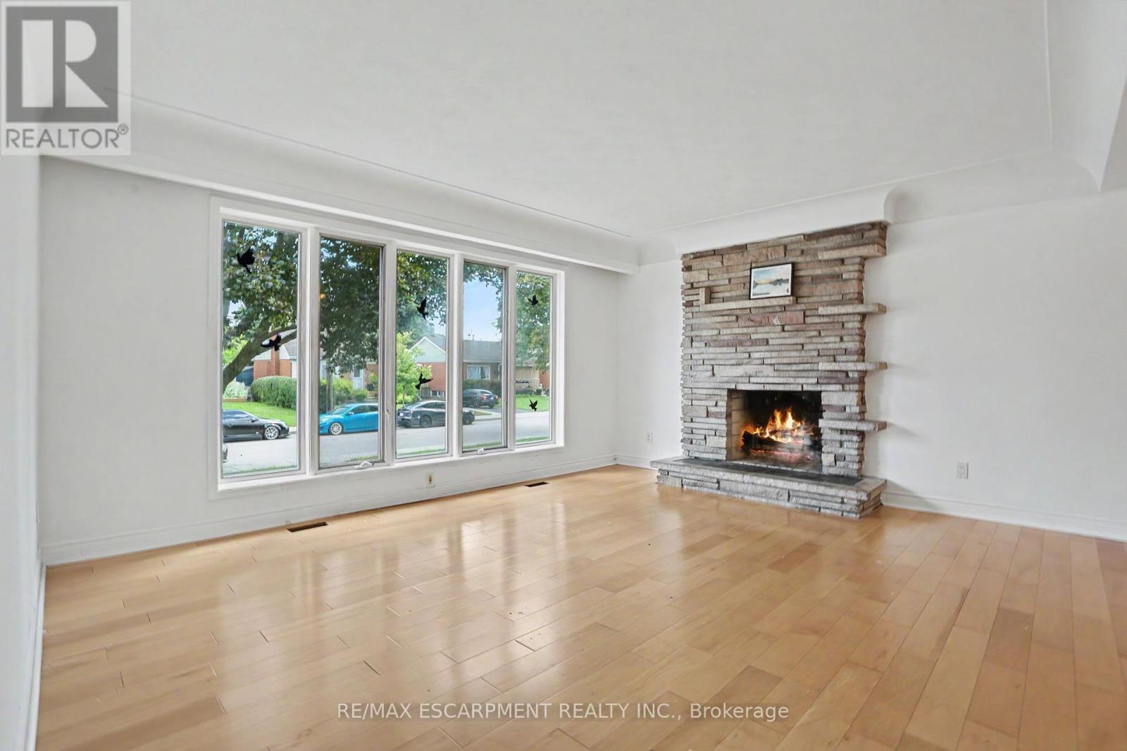 100 Hardale Crescent, Hamilton, ON - Indoor Photo Showing Living Room With Fireplace