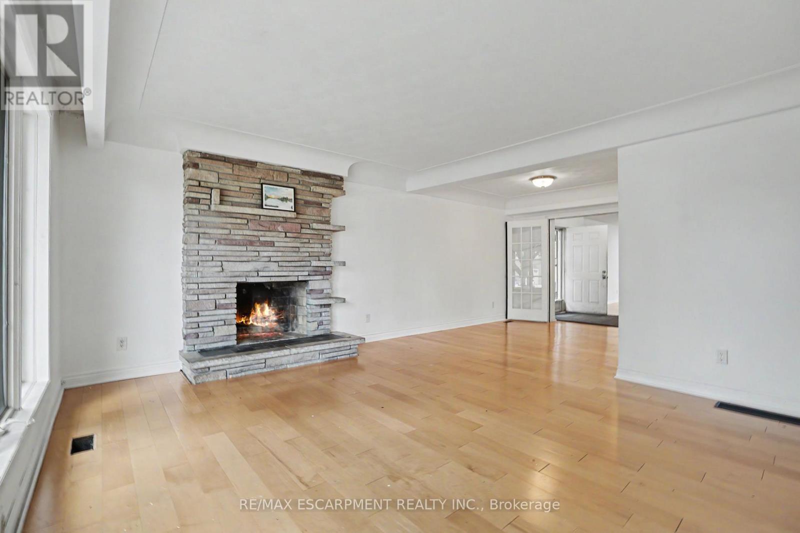 100 Hardale Crescent, Hamilton, ON - Indoor Photo Showing Living Room With Fireplace