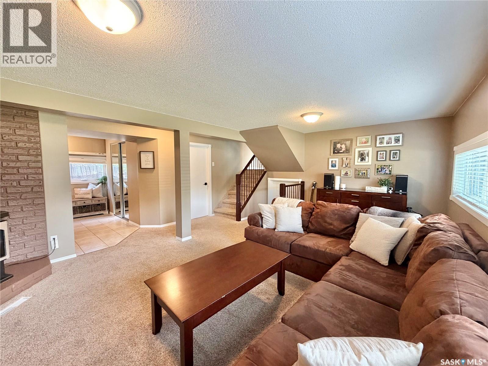 9 Gibson Bay, Yorkton, SK - Indoor Photo Showing Living Room With Fireplace