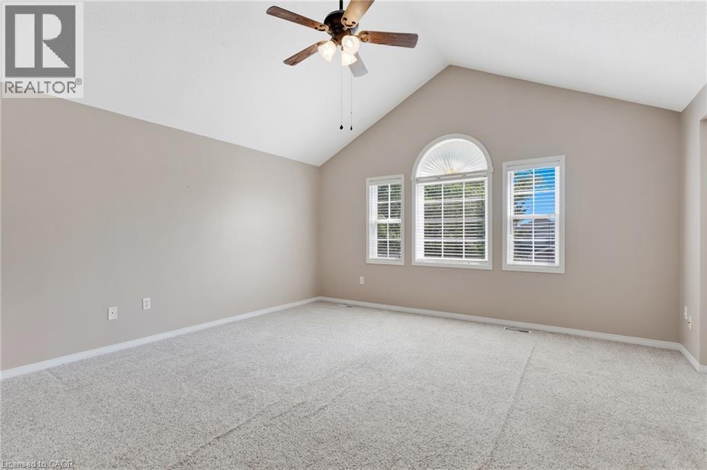 Vaulted ceiling with a ceiling fan light fixture - 129 Kovac Road, Cambridge, ON - Indoor Photo Showing Other Room