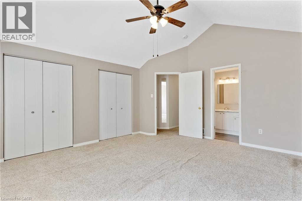 Carpeted room with a vaulted ceiling and ceiling fan - 129 Kovac Road, Cambridge, ON - Indoor Photo Showing Other Room