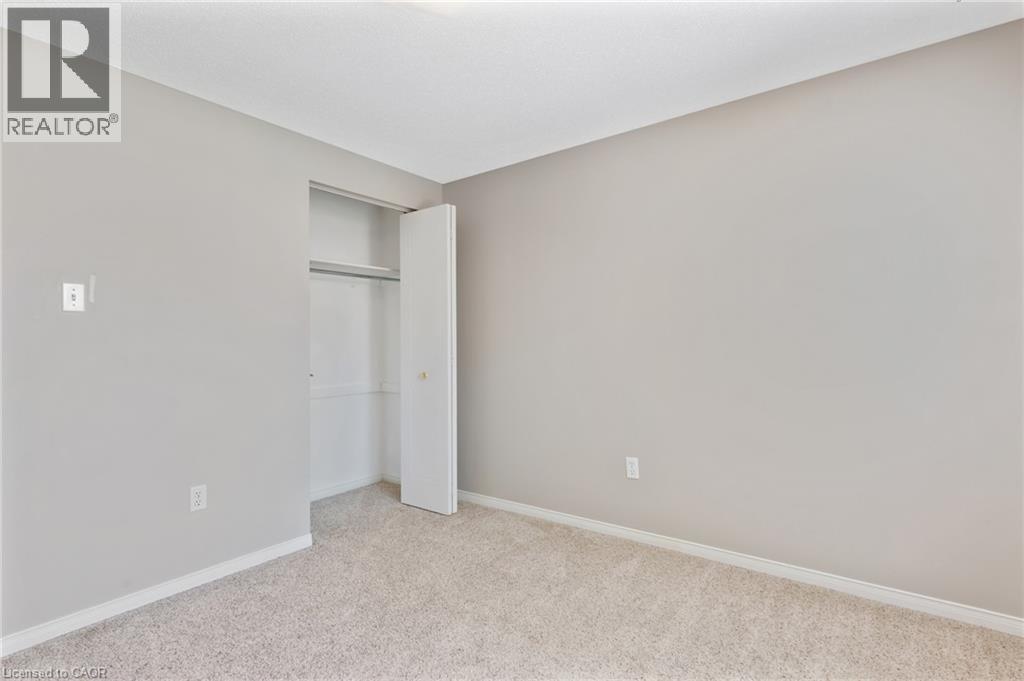 Neutral-toned room with light gray walls and white trim - 129 Kovac Road, Cambridge, ON - Indoor Photo Showing Other Room