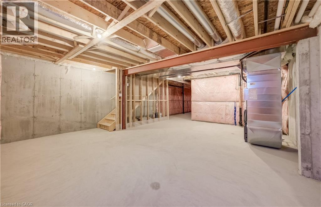 Unfinished basement with concrete flooring and exposed wood framing - 89 Rivergreen Crescent, Cambridge, ON - Indoor Photo Showing Basement