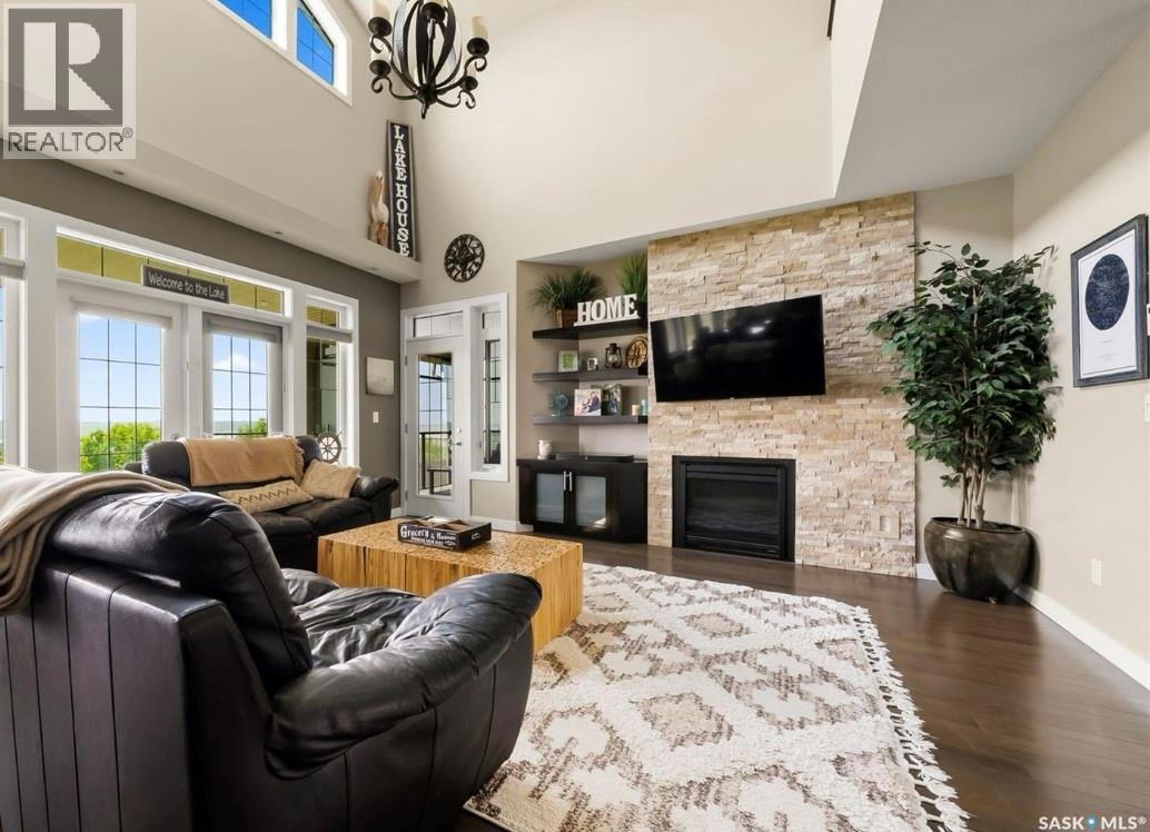 30 Shore Acres Drive, Last Mountain Lake, SK - Indoor Photo Showing Living Room With Fireplace
