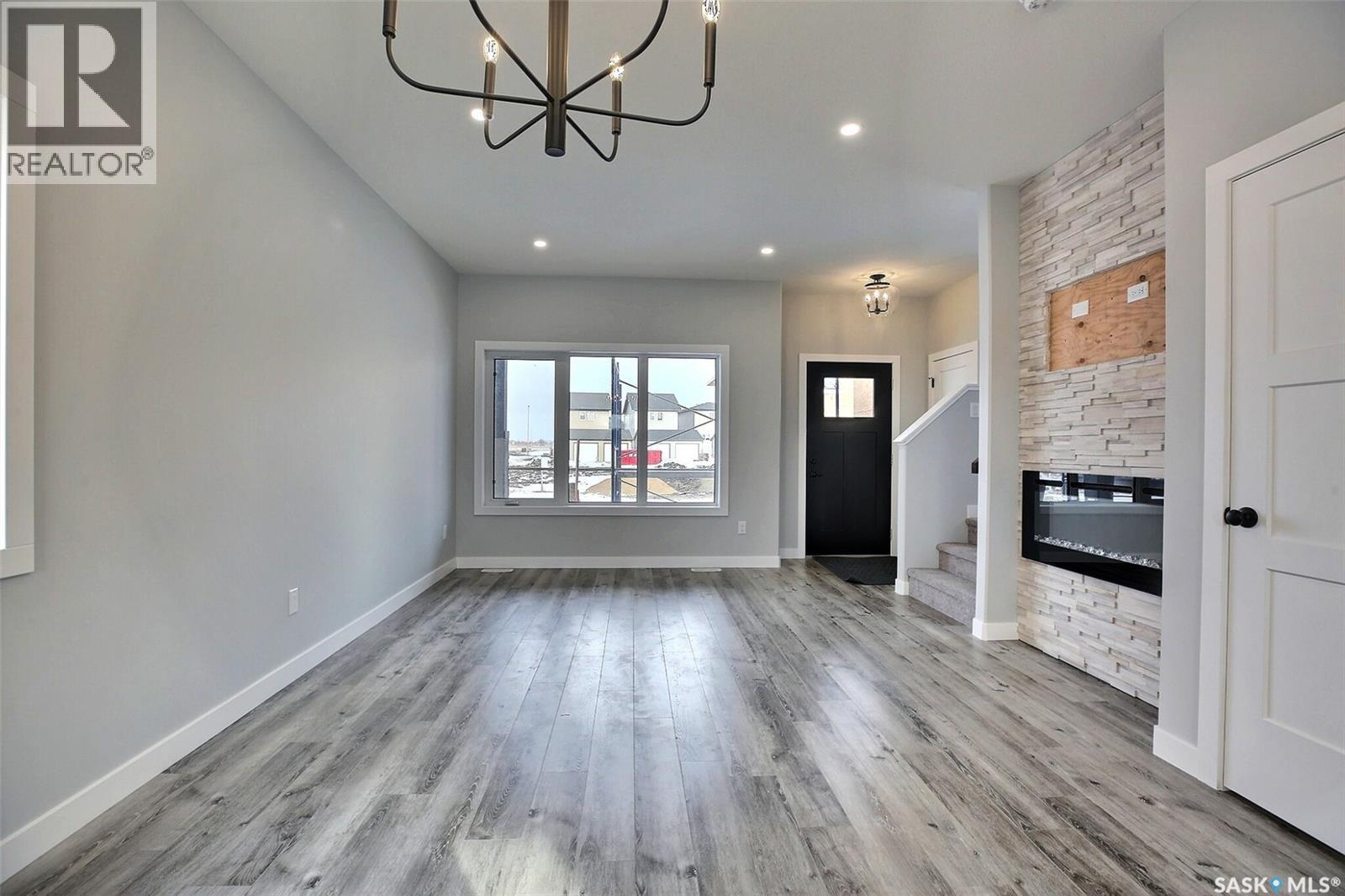 2956 Green Turtle Road, Regina, SK - Indoor Photo Showing Other Room With Fireplace