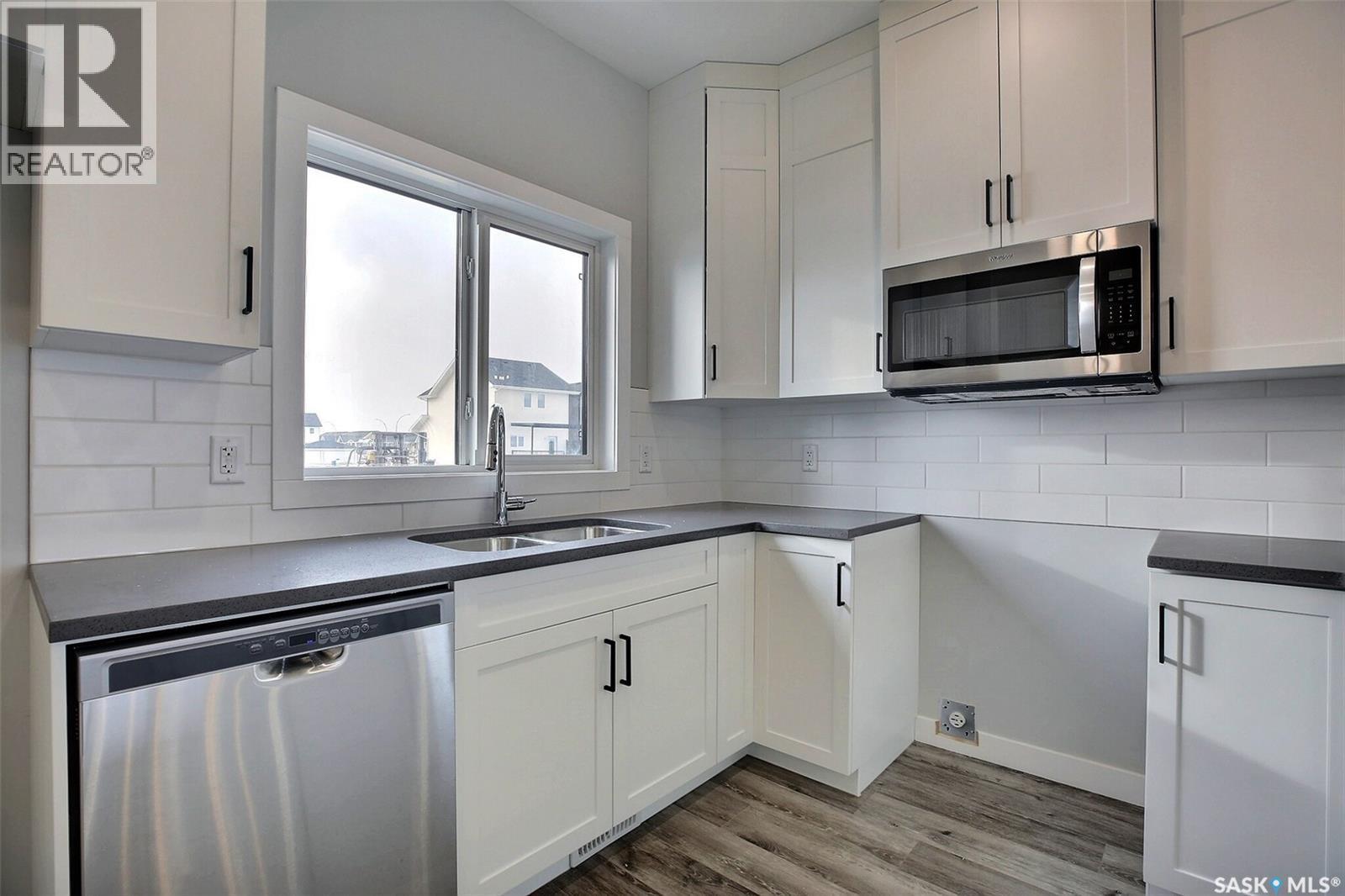 2956 Green Turtle Road, Regina, SK - Indoor Photo Showing Kitchen With Double Sink