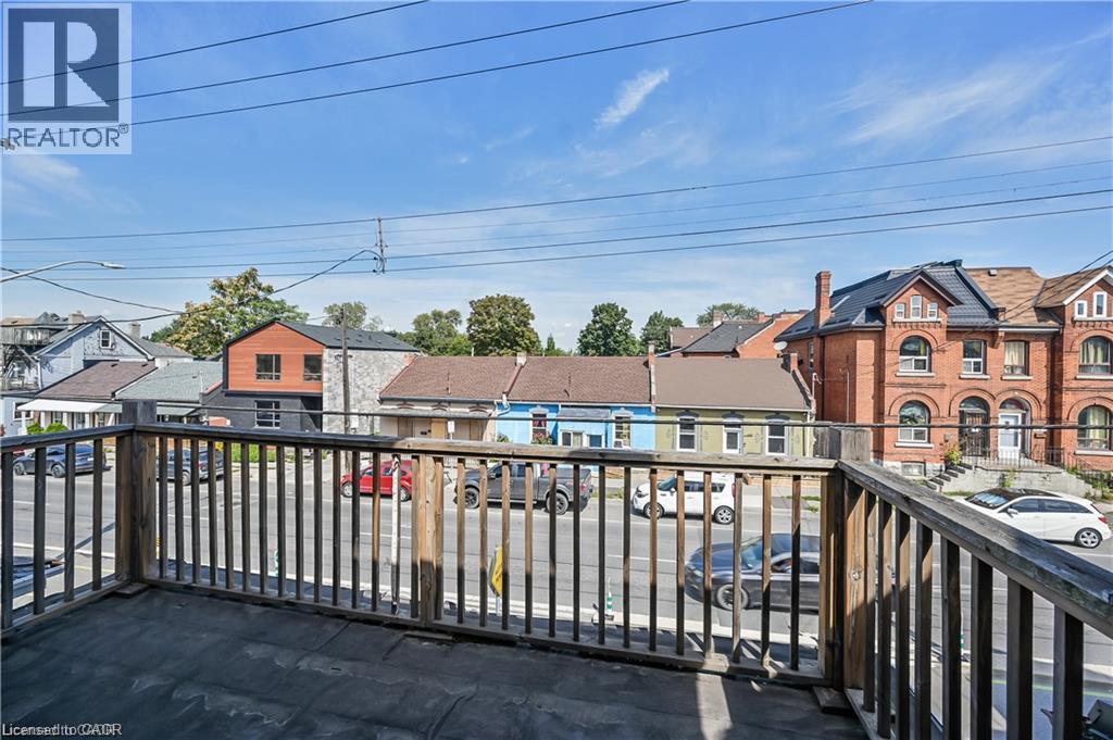 Rooftop deck featuring wood railing and dark-colored surface - 334 Cannon Street E, Hamilton, ON - Outdoor