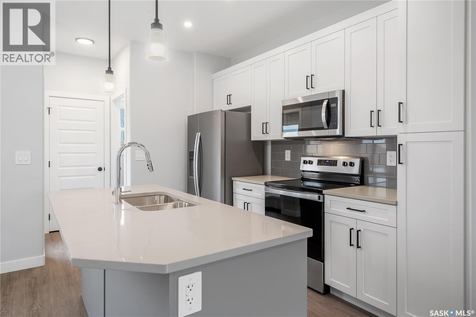 2960 Green Turtle Road, Regina, SK - Indoor Photo Showing Kitchen With Double Sink With Upgraded Kitchen