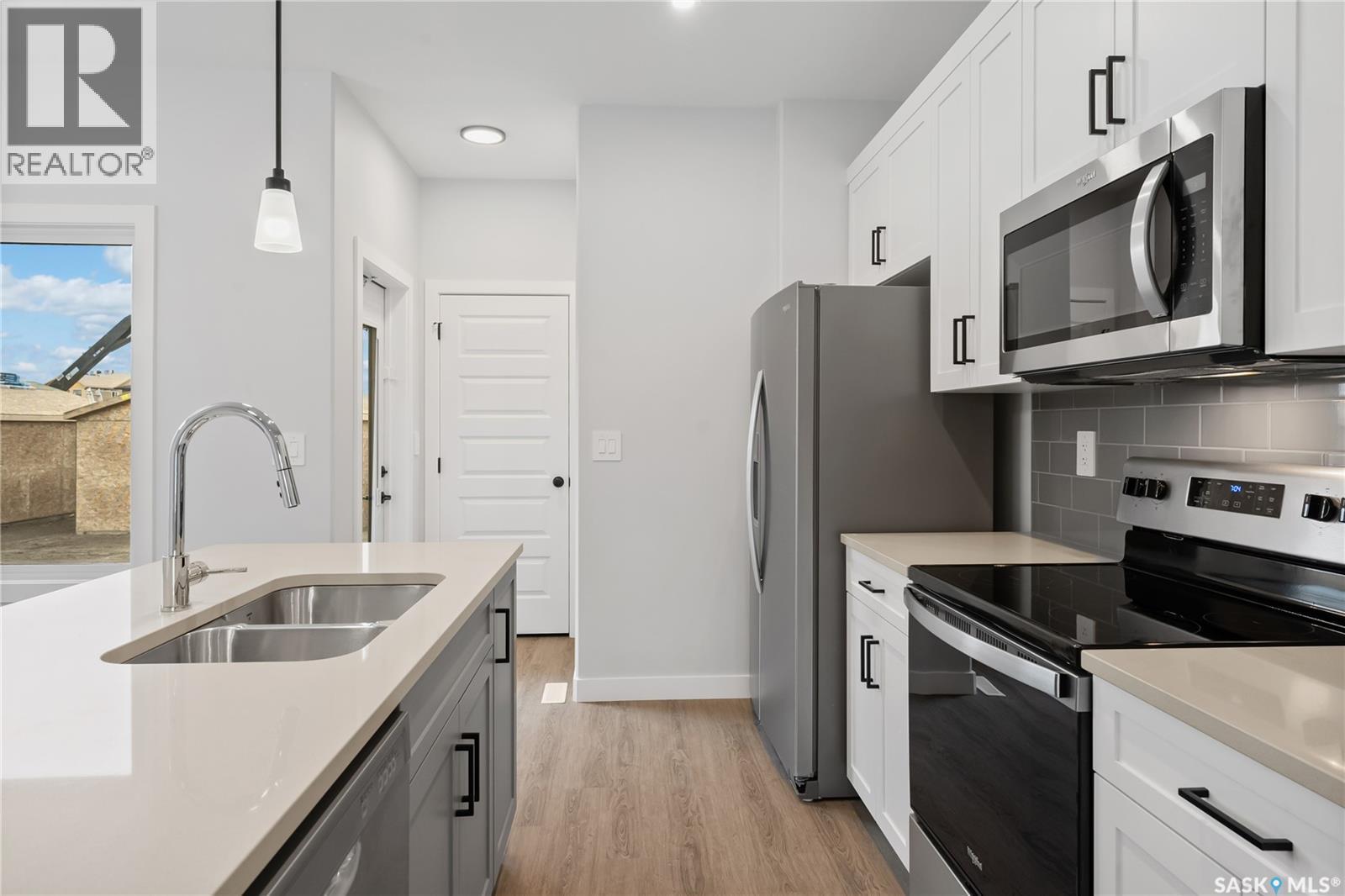2960 Green Turtle Road, Regina, SK - Indoor Photo Showing Kitchen With Double Sink