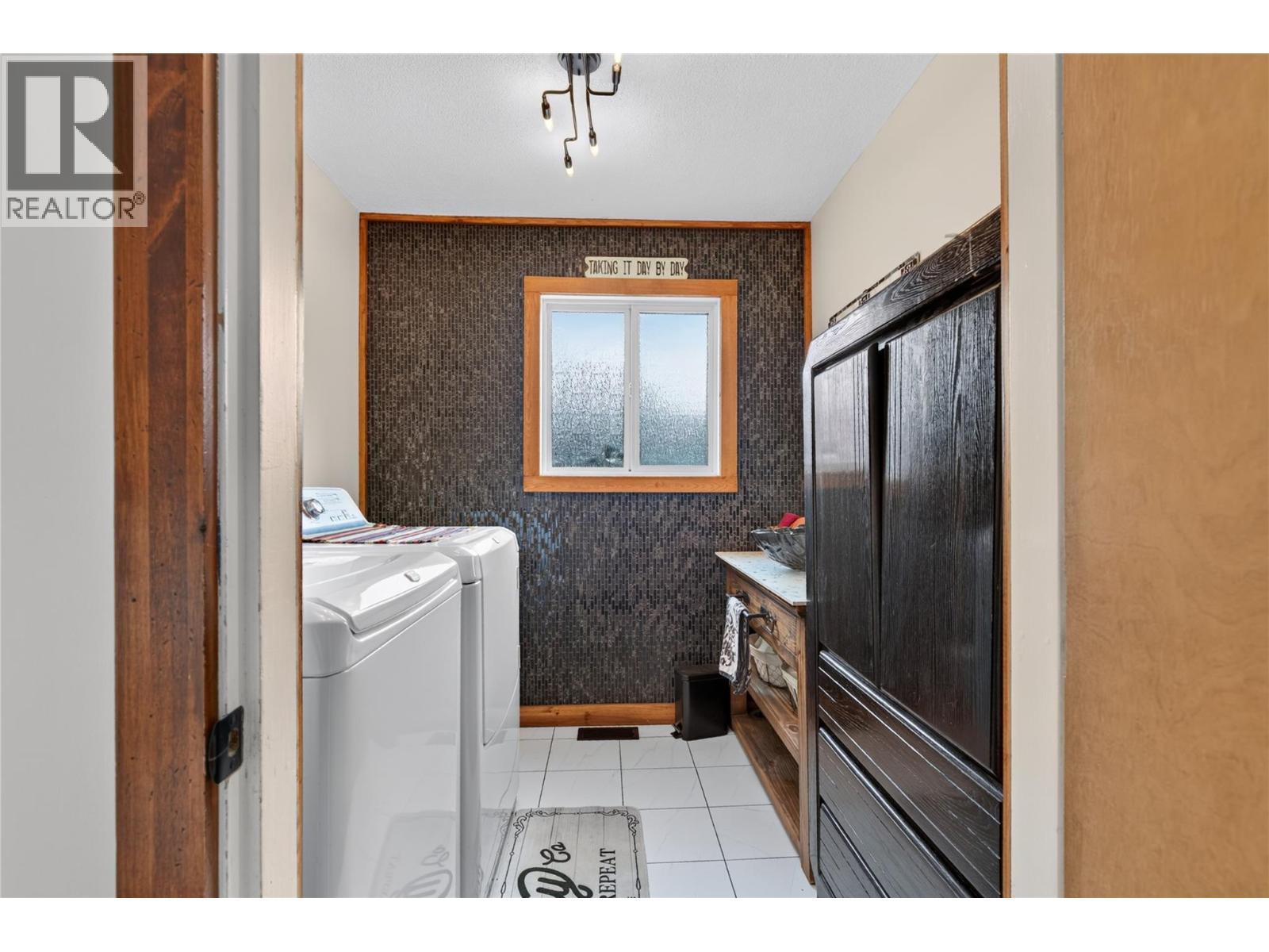 Laundry - 6415 Glendora Way, Coldstream, BC - Indoor Photo Showing Laundry Room