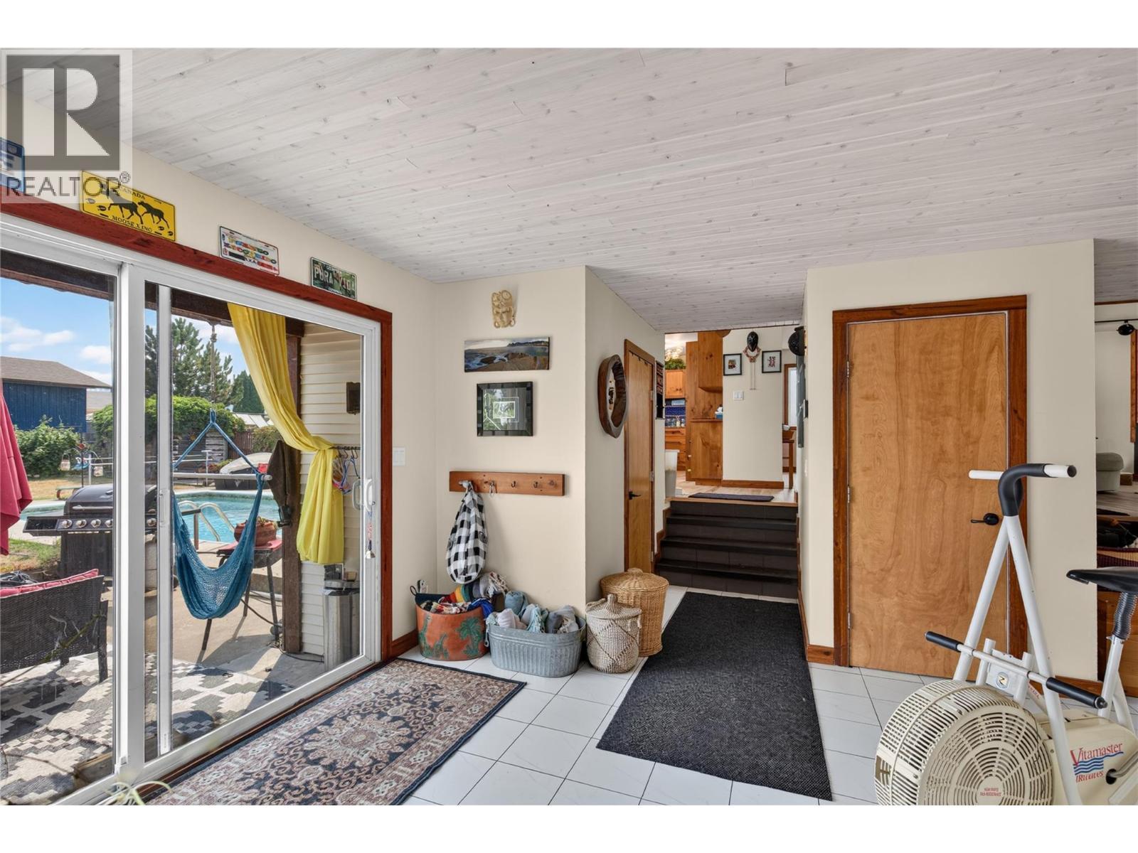 Family area - 6415 Glendora Way, Coldstream, BC - Indoor Photo Showing Gym Room